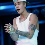 tatouage justin bieber tigre hibou bras