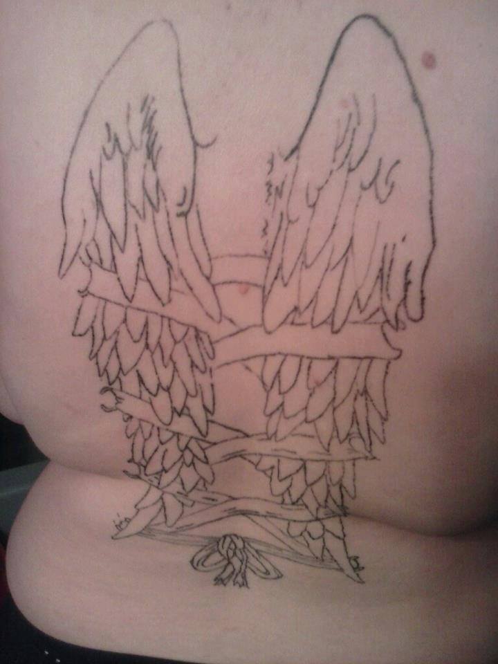 Tatouage raté ailes d'ange dans le dos